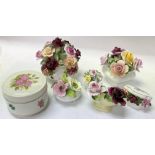 A collection of porcelain posy flower items, inclu