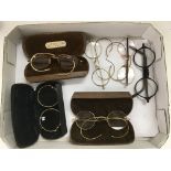 Six pairs of antique reading glasses.