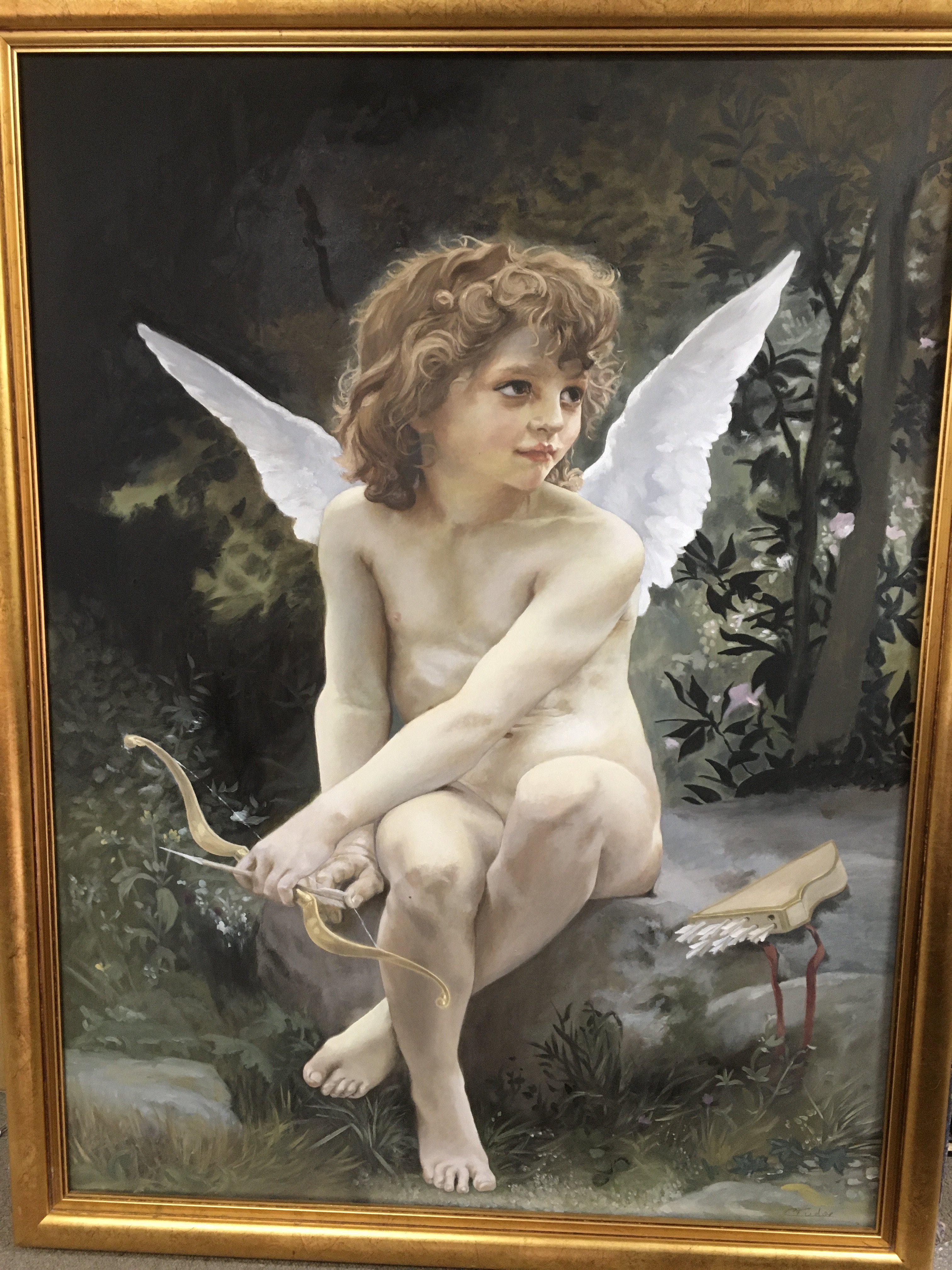 A large gilt framed oil on canvas of a winged cher