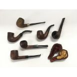 A small collection of vintage pipes.