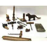 A collection of smokers pipes, nut crackers, light