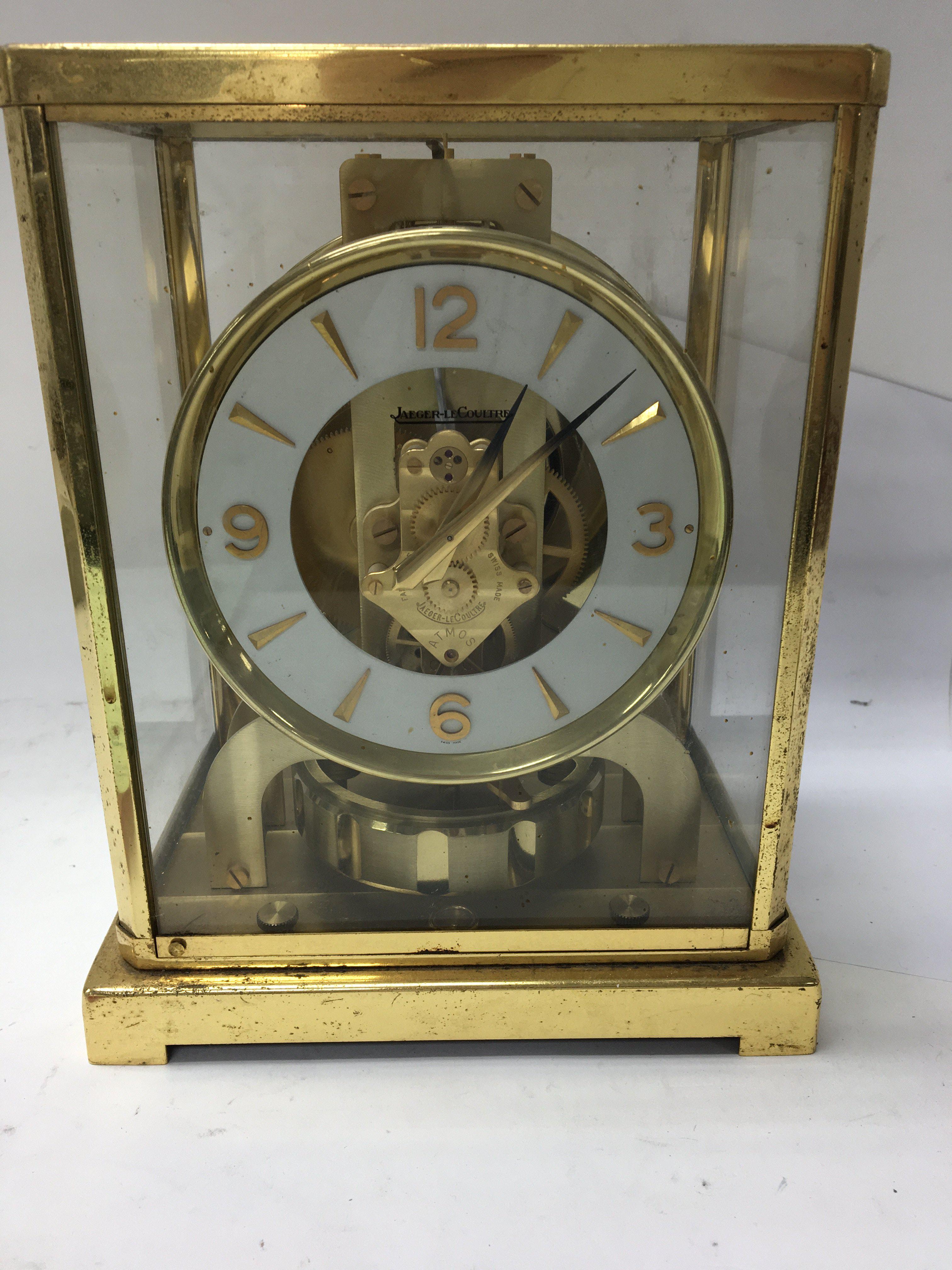 A gilt case Jaeger- Le Coultre Atmos clock . 23 cm