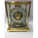 A gilt case Jaeger- Le Coultre Atmos clock . 23 cm