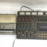 A Tascam 244 Portastudio and manual together with