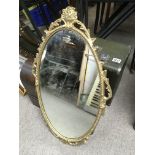 Two gilt framed wall mirrors.