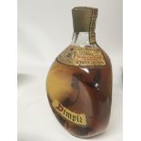 A Vintage bottle of Dimple Whisky. 26 2/3 fl Oz.