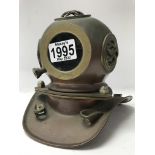 A small reproduction of a diver helmet