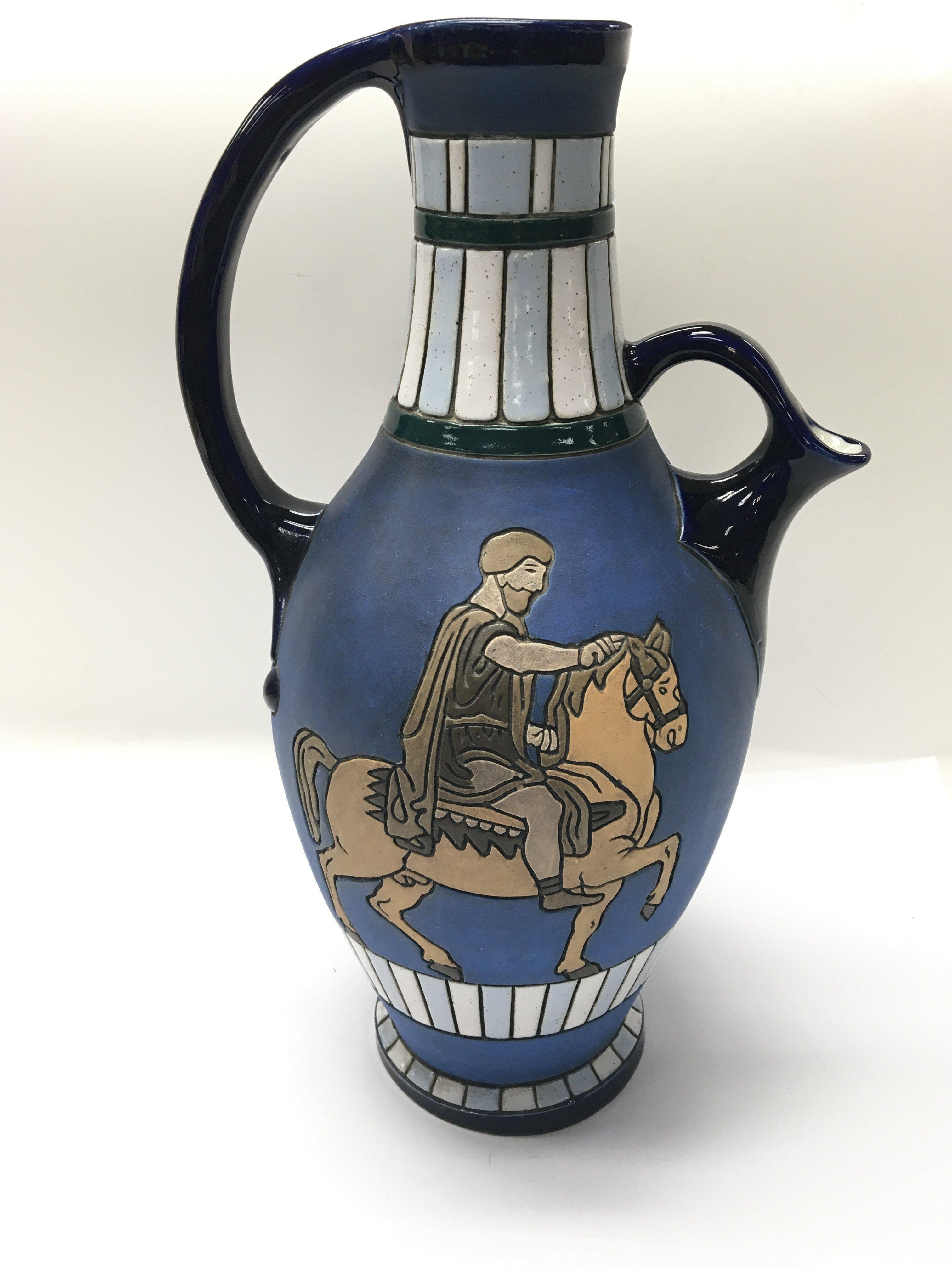 An Austrian jug depicting a man riding a horse, wi