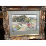 A gilt framed watercolour of a French garden scene