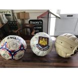 Three signed footballs as pictured.