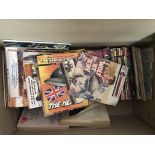 A box containing an assortment of vintage comics.