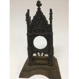 A Victorian cast iron gothic watch holder. Height