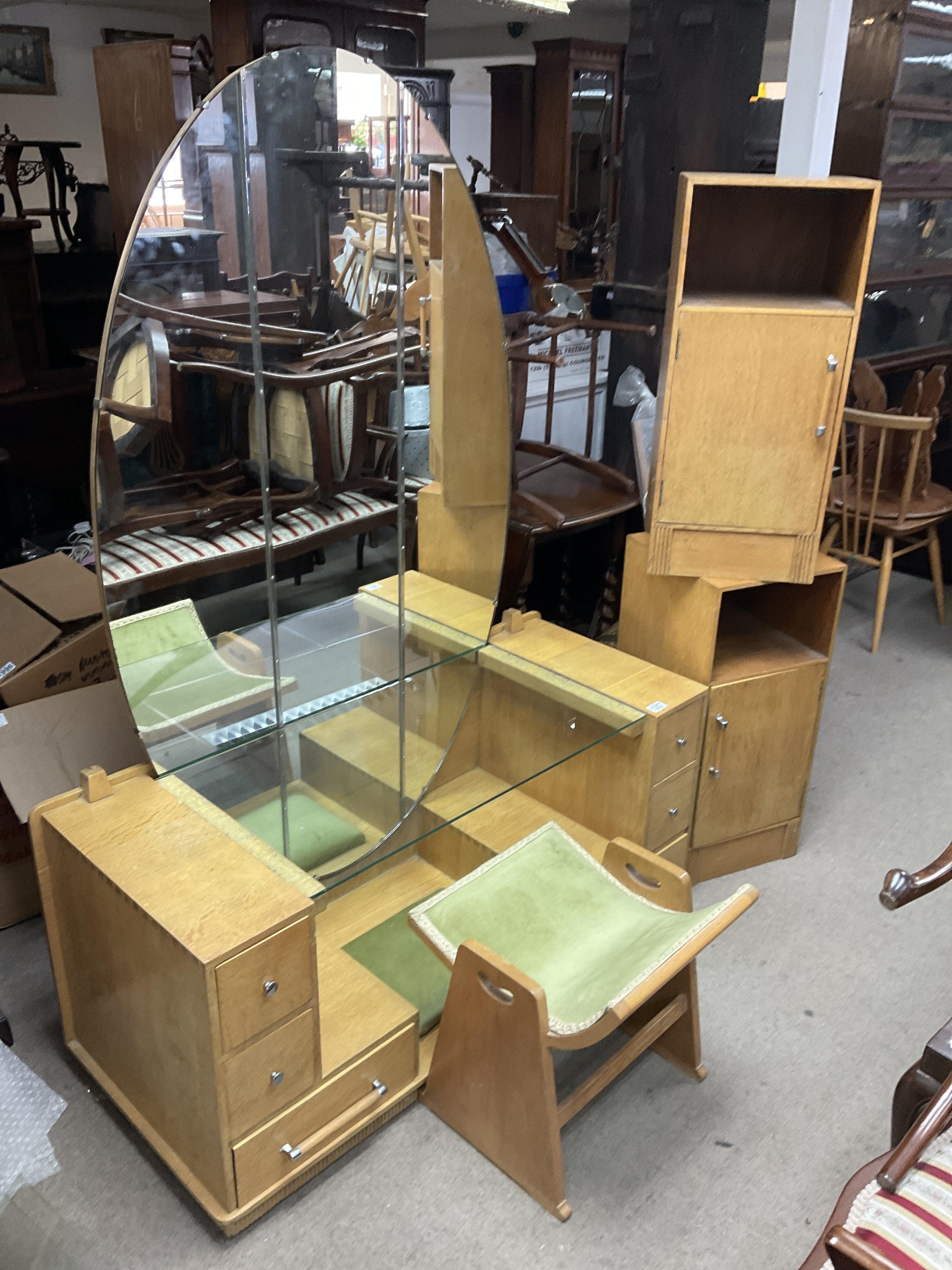 An Art Deco dressing table, stool and matching bed