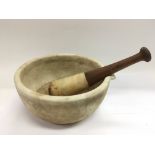 A large 19th Century pestle and mortar.