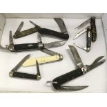 A collection of vintage pocket knives including on