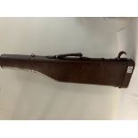 A vintage leather gun case.