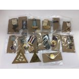 A collection of vintage Masonic and Buffalo jewels