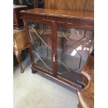 A Mahogany two door display cabinet with glazed sh