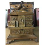 A carved jewellery box surrounded with a pheasant