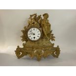 A small French gilt clock, 29cm. (No Key or Pendul