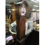 An oak longcase clock.