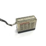 A Standard miniature transistor radio, approx widt