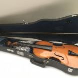 A cased Chinese violin and and bow. NO RESERVE.