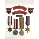 A group of GB WW2 medals and cloth badges.