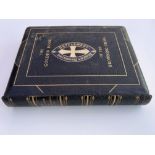 A leather bound book titled The Golden Book of The