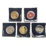 Two silver proof coins plus three others.