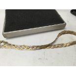 A three tone gold necklace 13 grams.