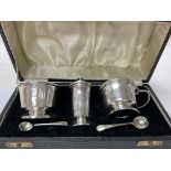 A cased silver cruet set.