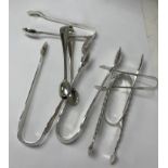 A collection of seven silver sugar tongs weighing