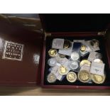 A box of mixed commemorative coinage.