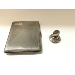 A silver cigarette case and a silver menu holder.