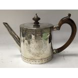 A Georgian silver tea pot 519 grams.