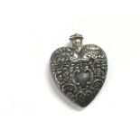 A silver heart shaped scent bottle,