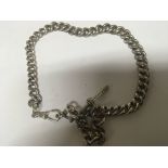A silver watch chain with graduating links and T b
