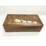 An Indian rosewood box inlaid with ivory elephants, approx 20cm x 10cm x 5cm.