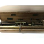 A antique brass telescope with tripod in wooden box. No makers mark seen. 126cm long.