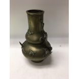 A Chinese bronze vase with raised dragon . 25 cm