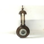Antique barometer-thermometer in carved wooden vase. 40cm approx.