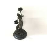 A bronze art Nouveau candleholder signed by Milo.