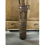 A large carved bamboo stick stand, 56cm. Together with a collection of canes.