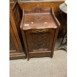 A small Victorian walnut carved drop front coal box.