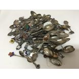 A large collection of silver spoons some decorated