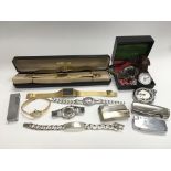 A collection of mixed watches, lighters, costume j