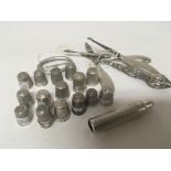 A collection of silver thimbles and other silver o