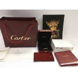 A boxed Cartier lighter, model 336304, with associ