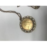 A full gold sovereign in mount with chain. 15grams